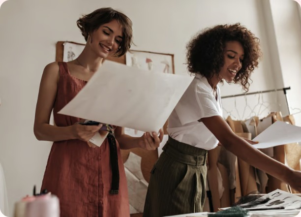 Two women working together on fashion designs